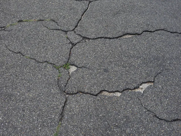 Fondo textura asfalto agrietado — Foto de Stock