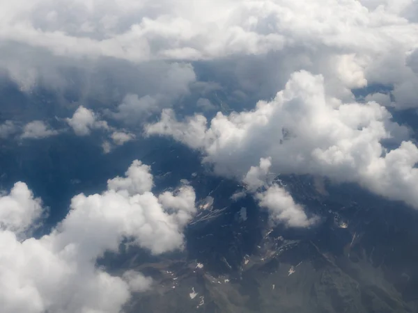 Blue sky with clouds background seen from flying plane — Stock Photo, Image