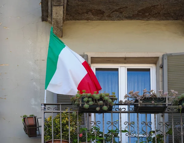 the Italian national flag of Italy, Europe on a balcony