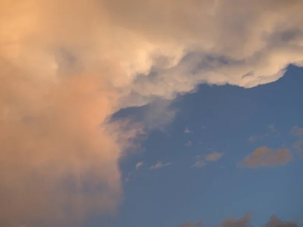 blue sky with red clouds at sunset useful as a background