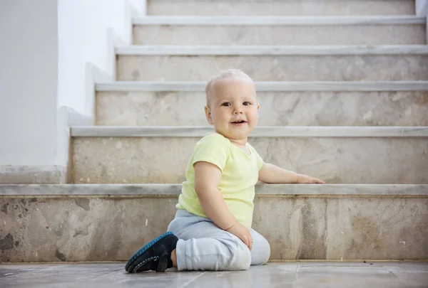 Happy baby girl at bottom of stairs outdoors — Stock Photo, Image