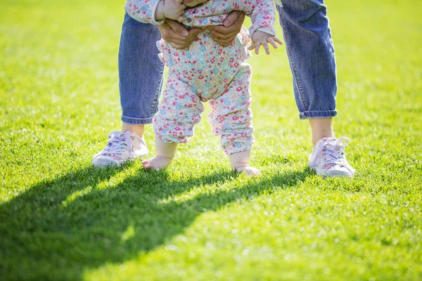 Cropped view of mother supporting baby daughter — Stock Photo, Image