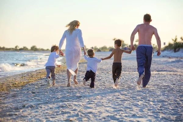 Happy Young Family Holding Hands Running Beach Sunset — Stock Photo, Image