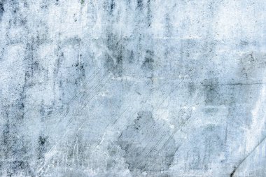 Eski mavi duvar çizikler ve çatlaklar. Kırık boya ve sıva doku.