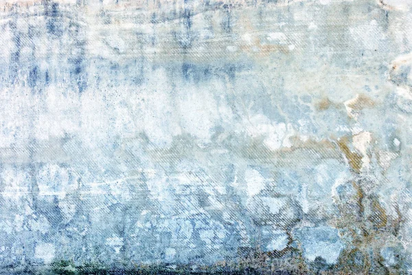 Abstract light blue background. Photo of an old wall. Texture with spots and dents.