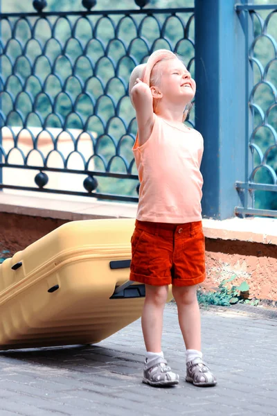 Little Girl Hat Red Shorts Carrying Big Yellow Suitcase Child — Stock Photo, Image