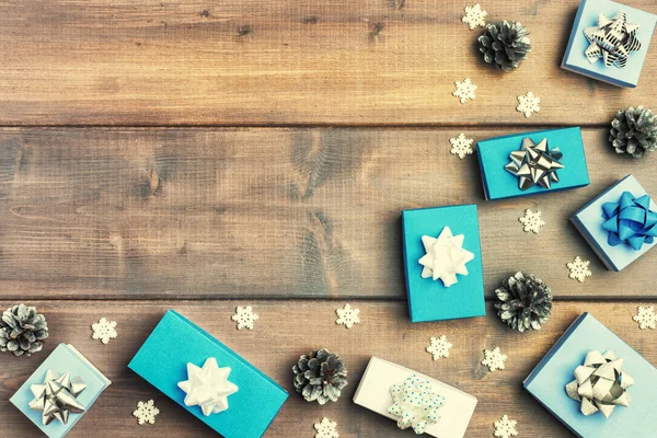 White Blue Boxes Lying Fir Cones Wooden Background — Stock Photo, Image