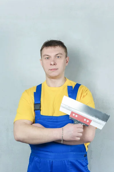 Man Yellow Shirt Blue Overalls Folded His Arms His Chest — Stock Photo, Image