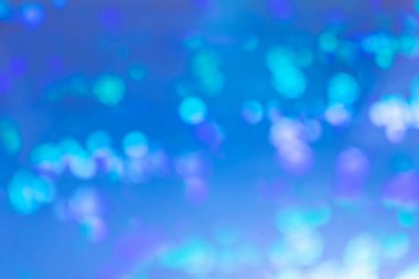 Parlak mavi soyut arka plan. Lekeler, bulanıkışıklar.