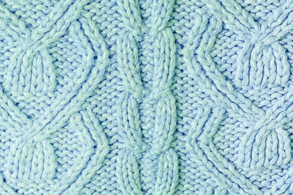 Knitted texture with patterns close-up. Blank blue background for layouts. — Stock Photo, Image