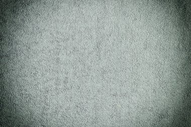 Koyu gri havlu nun dokusu. Eşit kumaş serilmiş. Vinyet ile arka plan.