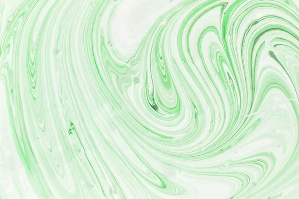 Yeşil ve beyaz boya güzel bir soyut desen oluşturarak karışık. Boş arka plan. — Stok fotoğraf