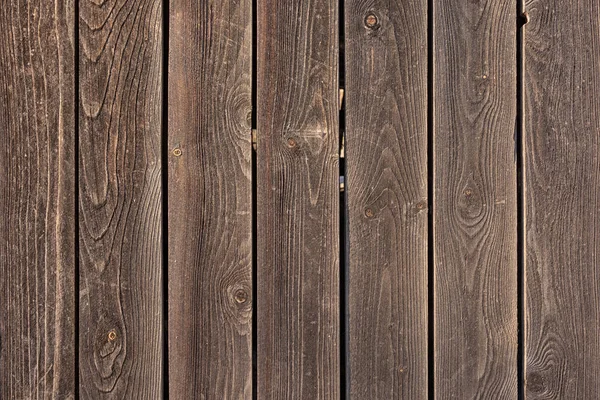 A cerca é feita de tábuas de madeira plana. Fundo vazio com textura de placas marrons . — Fotografia de Stock