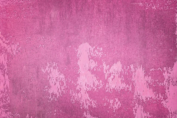 Old wall painted with dark pink paint. Uneven texture, with stains and smudges. Background for layouts.