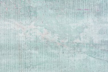 Sayfada benekler var. Düzen ve mekanlar için soyut hafif turkuaz arka plan. Eski bir çitin tonlu fotoğrafı.