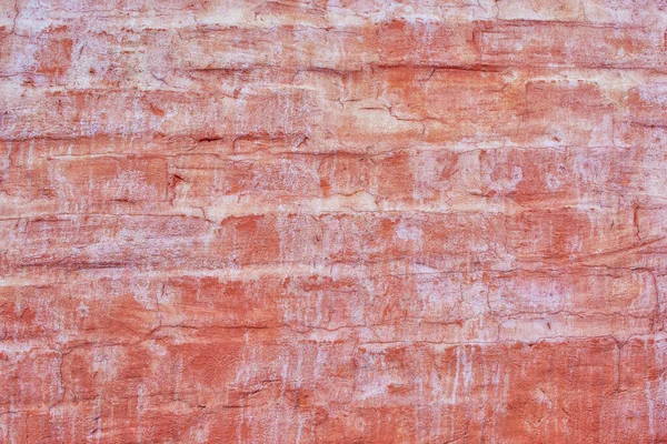 Кирпичная стена с темно-оранжевой краской. Старые пятна краски и пятна. Пустой фон для макетов и сайтов — стоковое фото