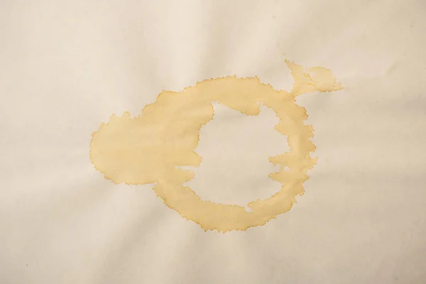 A sheet of the old paper with blots of tea or coffee. Dirty pape — Stock Photo, Image