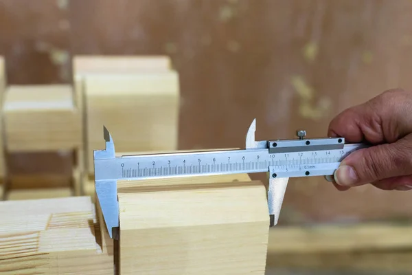 Carpenter doing his job at the factory for production glued timb — Stock Photo, Image