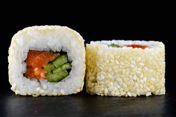 Delicious tasty sushi roll with cucumber, salmon and cream chees