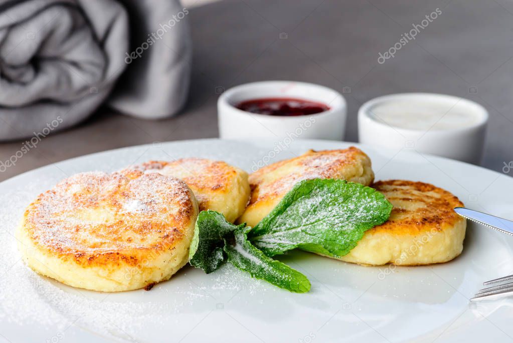 Sweet delicious cottage cheese pancakes, syrniki, curd fritters 
