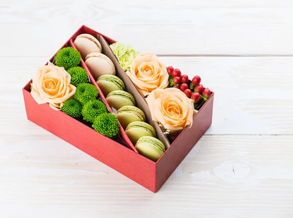 gift box with flowers and macaroon
