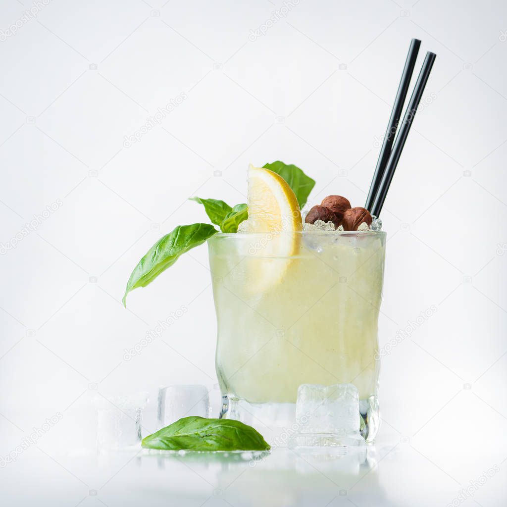 cocktail with alcohol, lime and basil