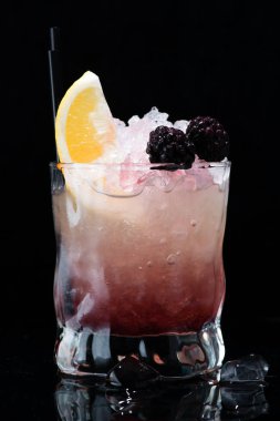 Bramble Cocktail on a dark background clipart