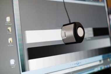 calibrating the display of a computer, close-up clipart