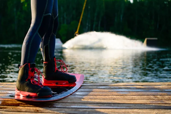 Men 's feet on a wakeboard — стоковое фото