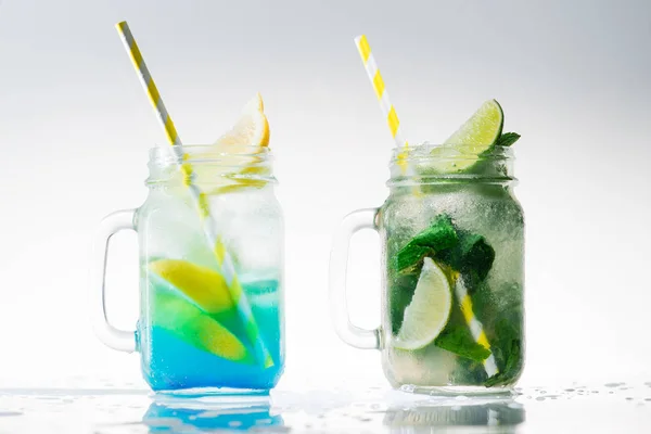 two mason jars with lemonade