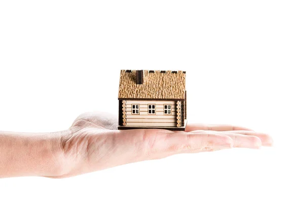 Küçük bir ev tutan el — Stok fotoğraf