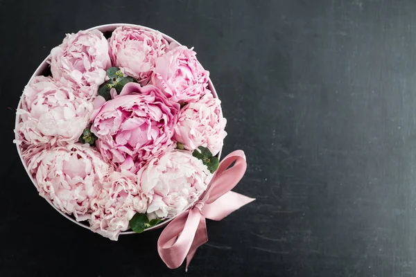 peonies flowers in a gift box