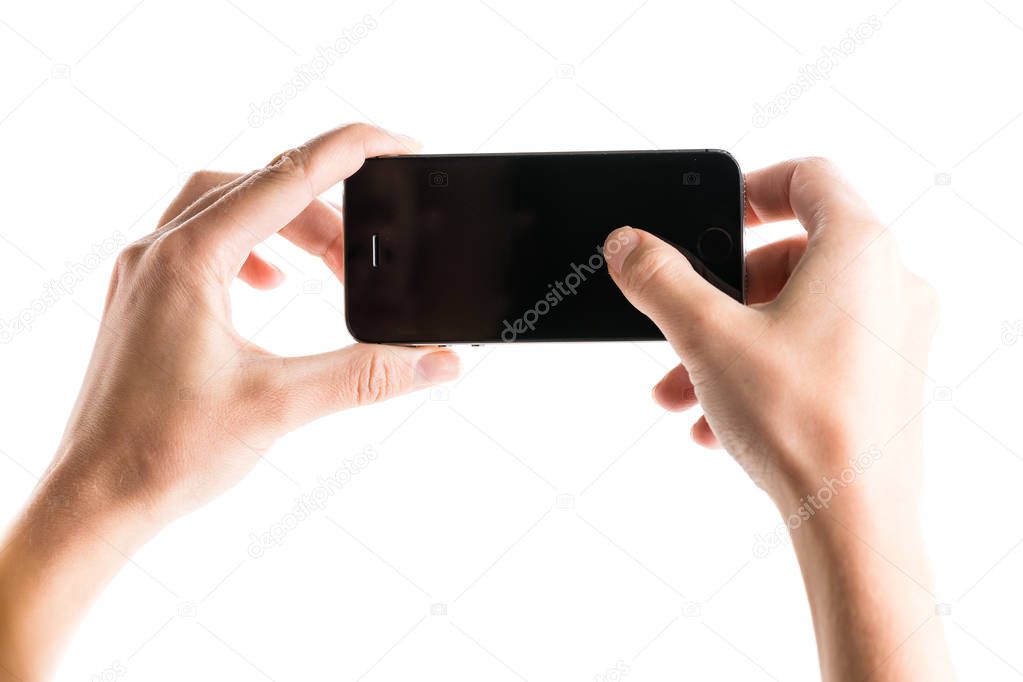 hands holding smartphone
