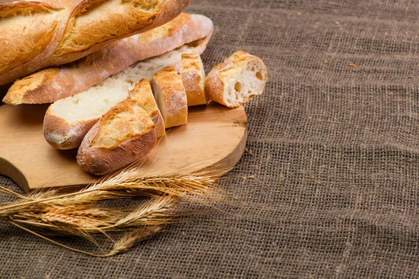 Still life with French fresh bread baguettes with poolish on a w — Stock Photo, Image