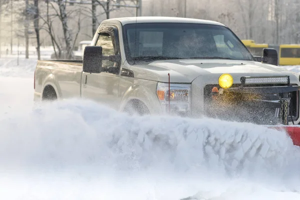 Car pickup cleaned from snow by snowplough during wintertime — Stock Photo, Image