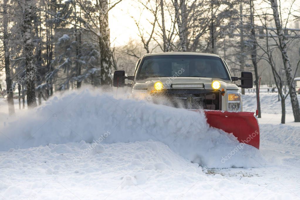 Snow plow doing snow removal after blizzard
