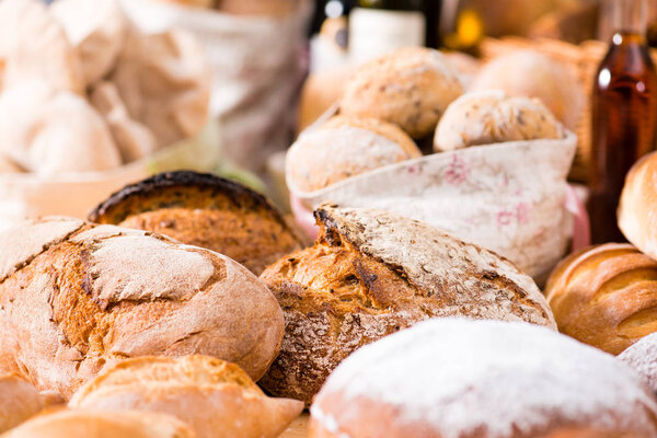 close-up traditional round artisan rye bread loaves with walnut 