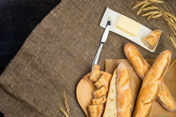 Still life with French fresh bread baguettes with poolish on a w — Stock Photo, Image