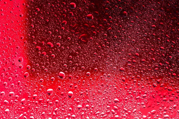 Gotas de agua en la superficie roja. Macro abstracto foto, fondo , —  Fotos de Stock