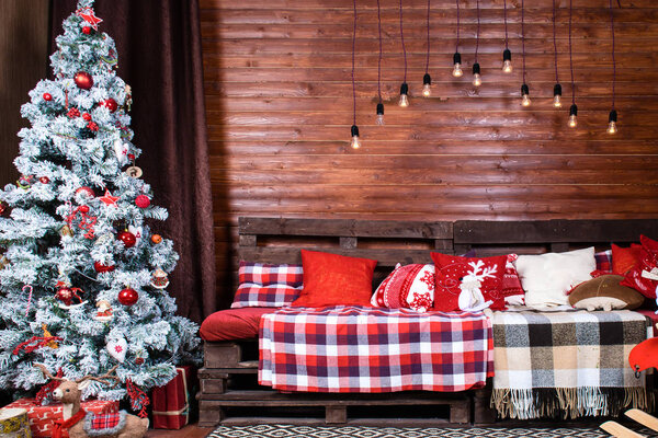 Beautiful Christmas interior design. Room decorated with wooden 