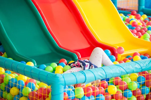 Children playground with plastic slides and colorful balls in po — Stock Photo, Image