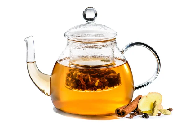 Herbal tea with cinnamon, cardamom and carnation in glass teapot — Stock Photo, Image