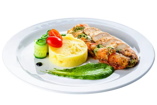 Grilled chicken fillet with pesto and sauce in a white plate iso — Stock Photo, Image