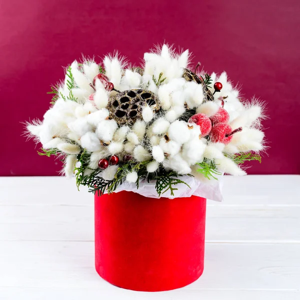 Beautiful creative decorative winter bouquet with berries, cotto — Stock Photo, Image