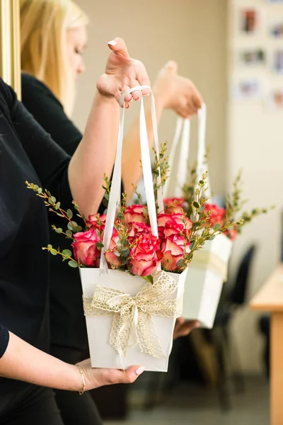 Box with fresh beautiful blossom red roses in woman hands, selec — Stock Photo, Image