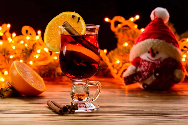 Christmas hot mulled wine in a glass with spices, anise, slice o — Stock Photo, Image
