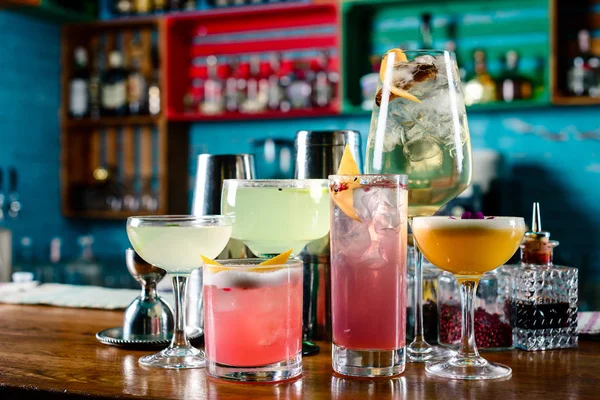 set of Classic alcoholic cocktails on bar counter in pup or restaurant with copy space