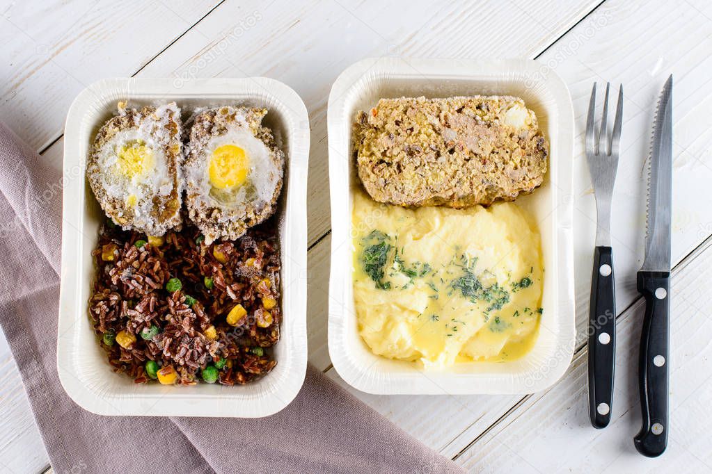 prepared frozen meal, container with unhealthy and unappealing tv dinner, dinners in containers ready to be frozen for later use as quick and easy ready meals. Microwave meals ready to heat up