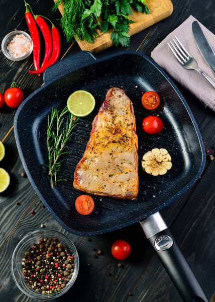 grill pan with ribs steak and vegetables, preparing delicious food for the culinary blog
