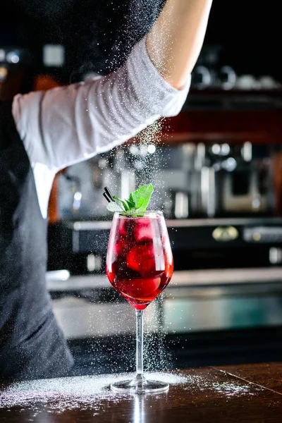 Bartender making Red Sangria in Italian restaurant.